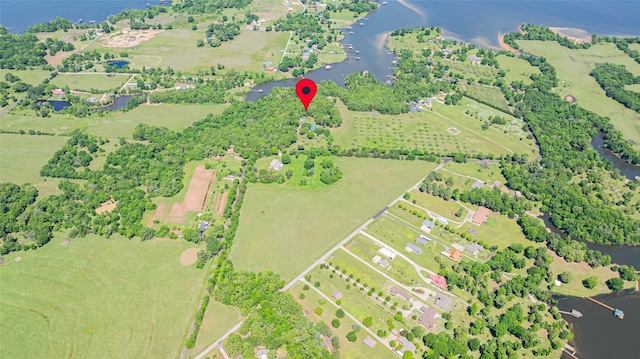 birds eye view of property featuring a rural view and a water view