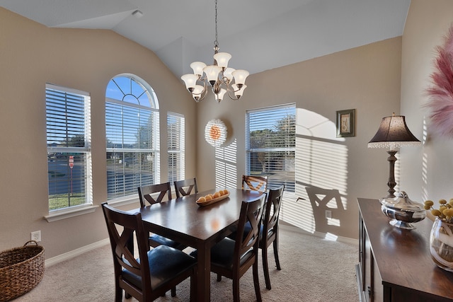 carpeted dining room featuring vaulted ceiling and a notable chandelier