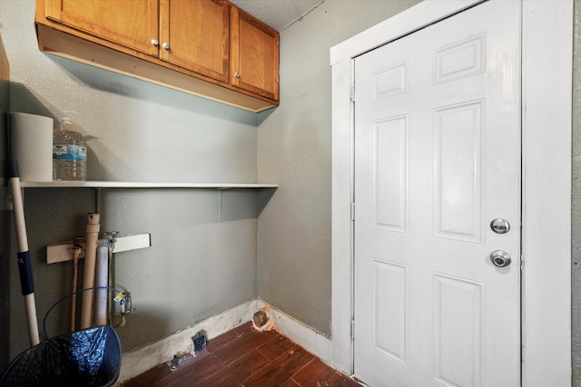 laundry room with dark hardwood / wood-style flooring