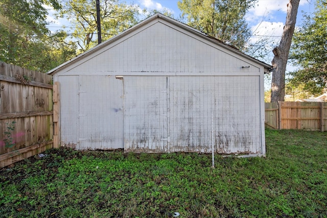 view of outbuilding featuring a yard