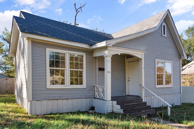 view of front of property with roof with shingles