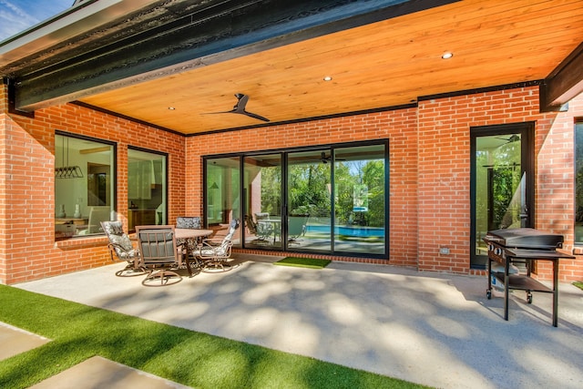 view of patio featuring ceiling fan