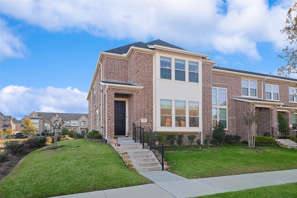 view of front of home with a front yard