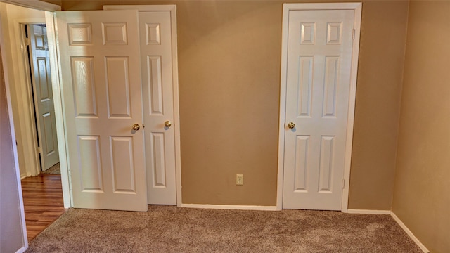 unfurnished bedroom with carpet floors