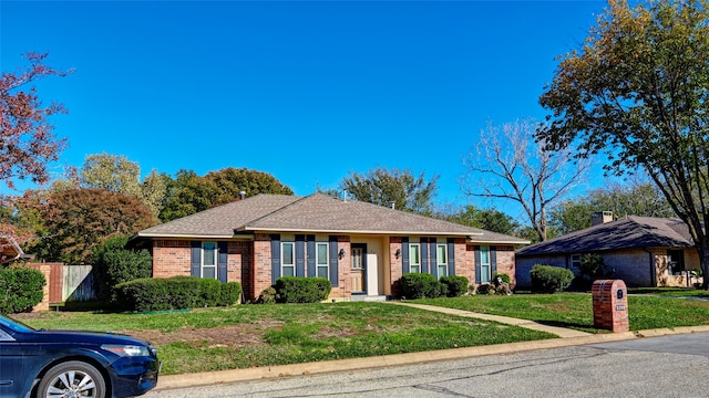 ranch-style house with a front yard