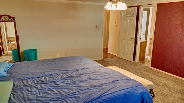 bedroom with ceiling fan, carpet, ensuite bathroom, and ornamental molding