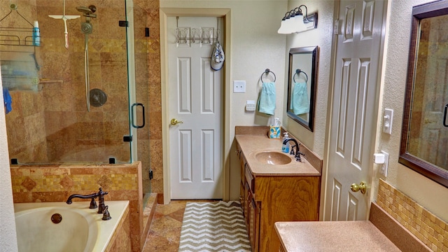 bathroom featuring vanity and separate shower and tub