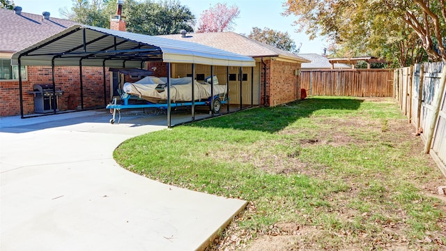 view of yard with a carport