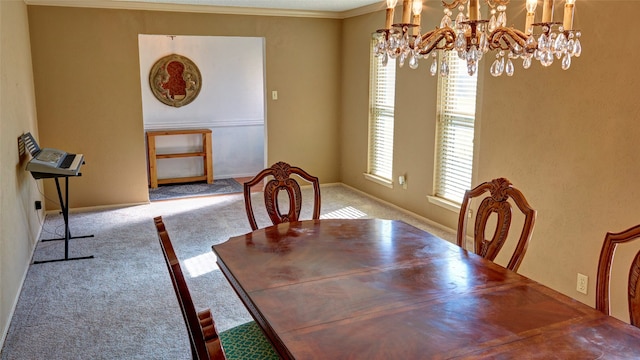 dining room with light colored carpet, an inviting chandelier, and crown molding