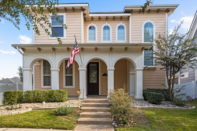 view of front of house with a balcony