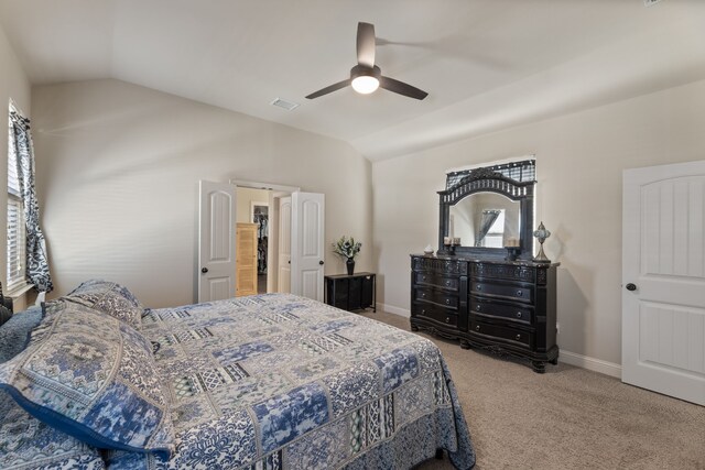 bedroom featuring carpet, vaulted ceiling, and ceiling fan