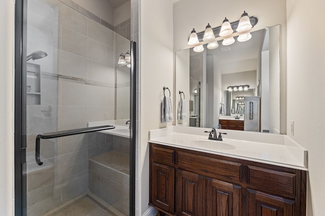 bathroom featuring vanity and walk in shower