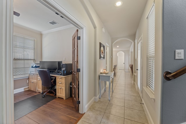 office featuring light hardwood / wood-style floors and ornamental molding