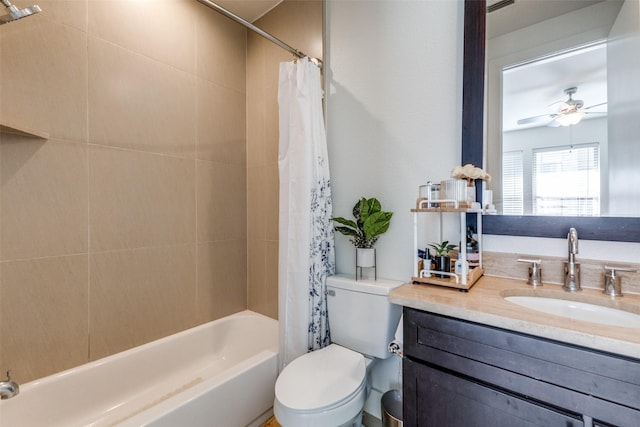 full bathroom with vanity, shower / bath combination with curtain, ceiling fan, and toilet