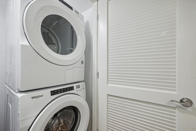 washroom with stacked washer / dryer