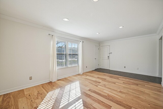 unfurnished room with light hardwood / wood-style flooring and ornamental molding