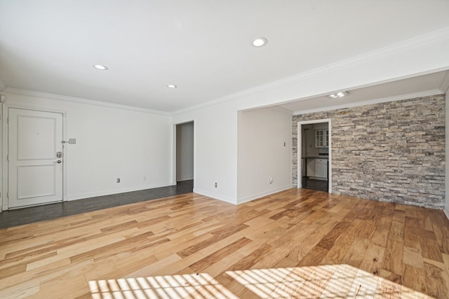 empty room featuring hardwood / wood-style floors and ornamental molding