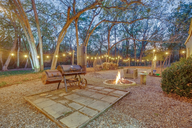 view of patio with a fire pit