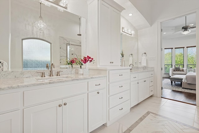 bathroom featuring wood-type flooring, a wealth of natural light, a shower with shower door, and ceiling fan