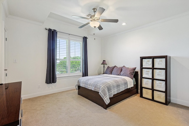 bedroom featuring ceiling fan, crown molding, and light colored carpet