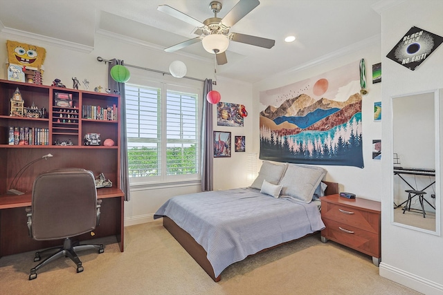 carpeted bedroom with ceiling fan and ornamental molding