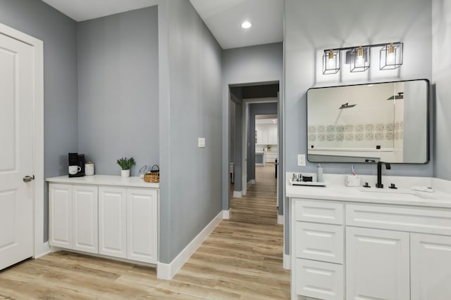 interior space with hardwood / wood-style floors and vanity