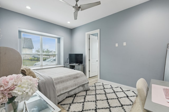 bedroom featuring light hardwood / wood-style flooring and ceiling fan