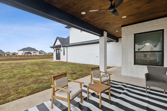 view of patio featuring ceiling fan