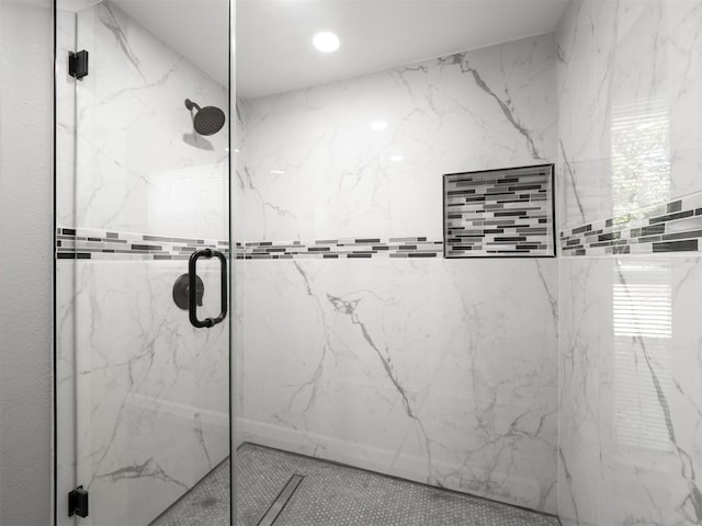 bathroom featuring an enclosed shower