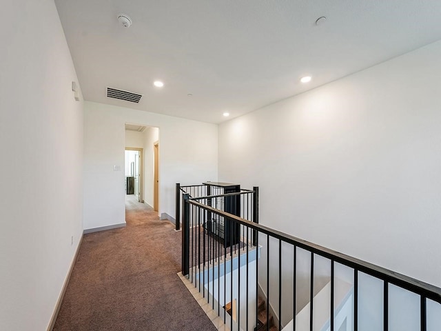 corridor featuring carpet flooring