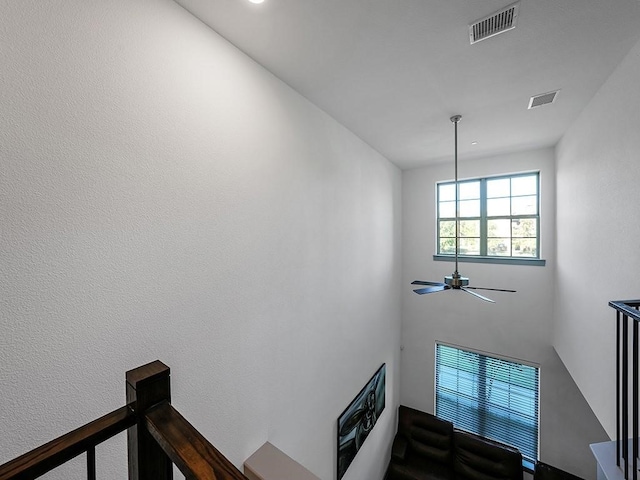 staircase with ceiling fan