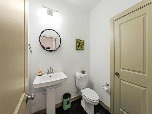 bathroom featuring tile patterned floors and toilet