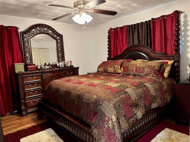 bedroom with hardwood / wood-style floors and ceiling fan