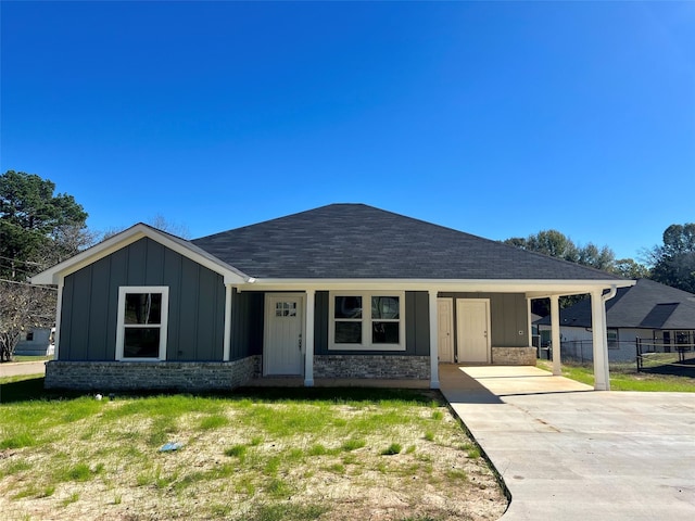 ranch-style house with a carport and a front yard