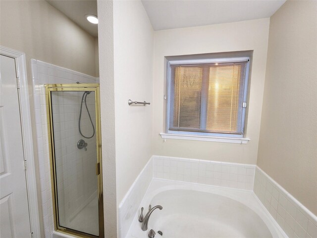 bathroom with independent shower and bath