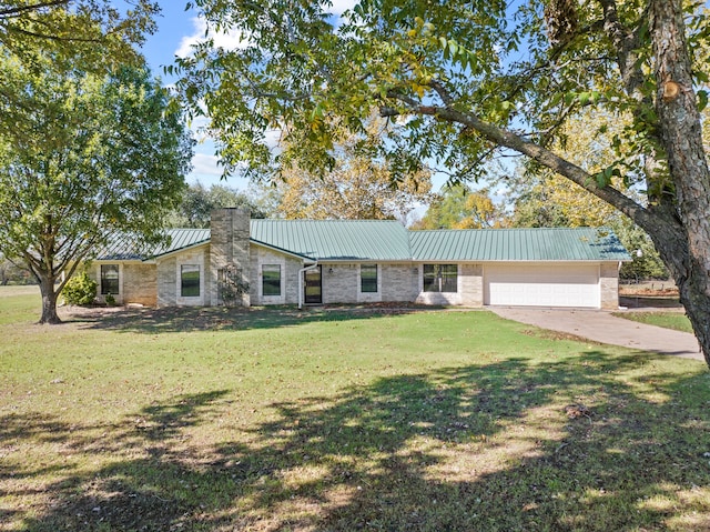 ranch-style house featuring a front yard and a garage