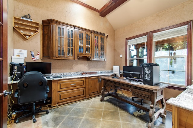 office area with vaulted ceiling with beams, built in desk, and ornamental molding