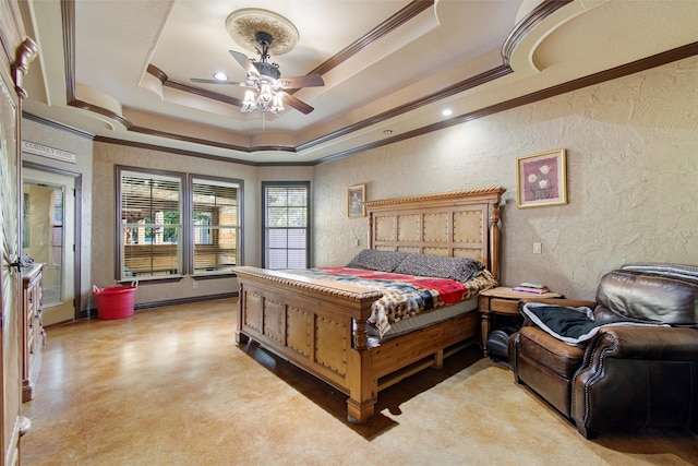 bedroom featuring a raised ceiling, ceiling fan, and ornamental molding