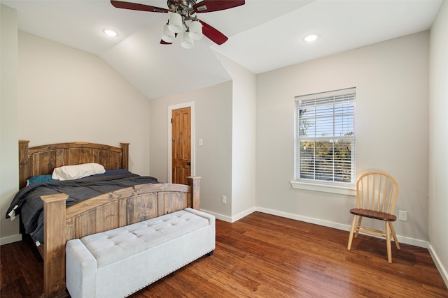 bedroom with dark hardwood / wood-style flooring, ceiling fan, and lofted ceiling