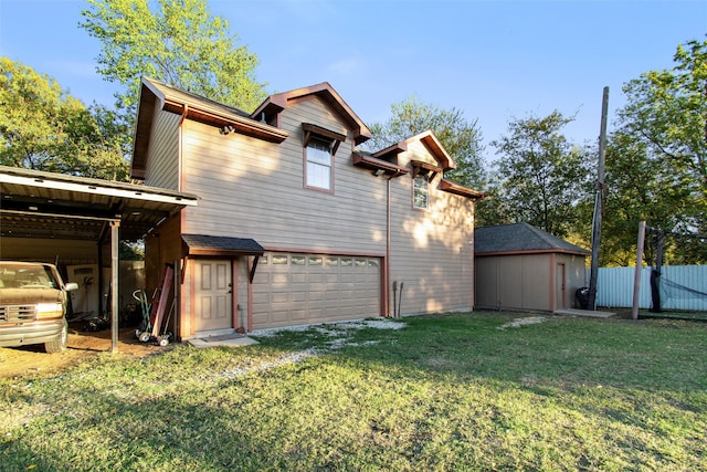 back of house featuring a carport, a garage, and a yard