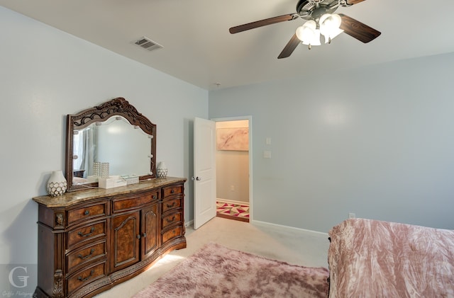 living area featuring ceiling fan and light colored carpet