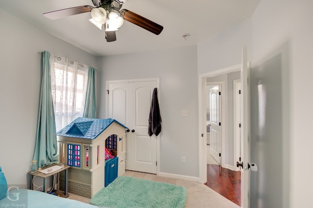 bedroom with ceiling fan and light hardwood / wood-style flooring