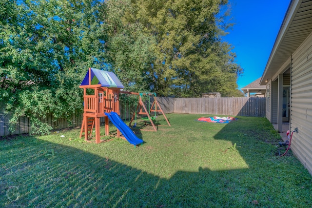 view of jungle gym with a yard