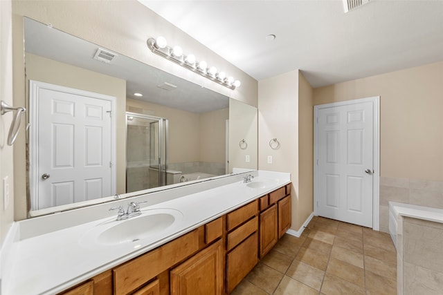 bathroom featuring vanity, tile patterned floors, and independent shower and bath