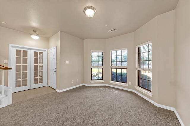575 S Virginia Hills Dr Unit 303, Mckinney, TX 75072 - carpeted empty room featuring french doors and baseboards