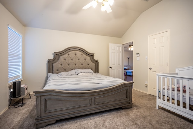 bedroom featuring ceiling fan, lofted ceiling, and dark colored carpet