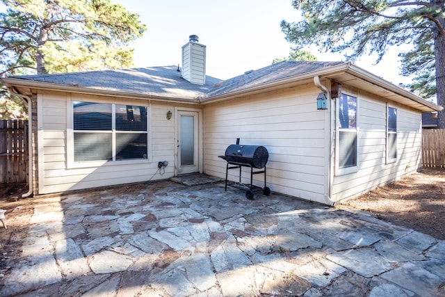 back of house with a patio