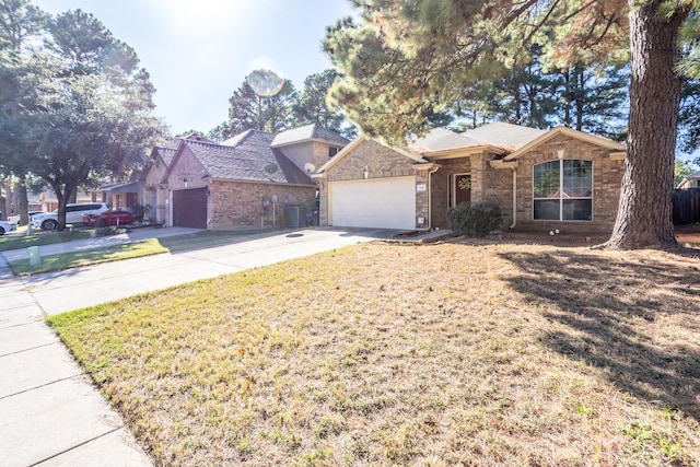 view of front of property featuring a garage and a front yard