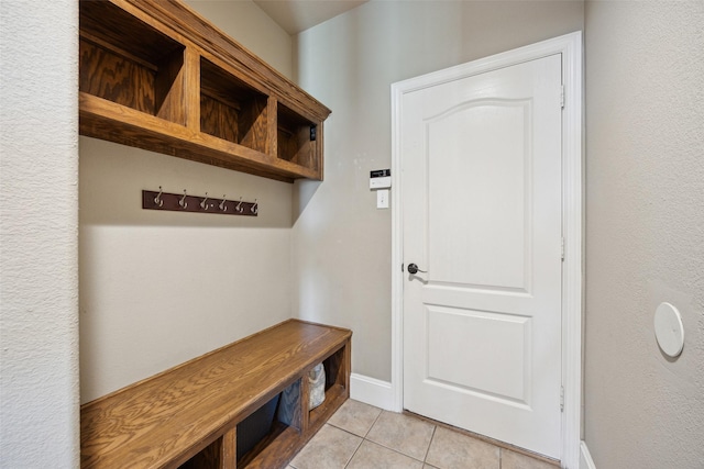 mudroom with light tile patterned floors