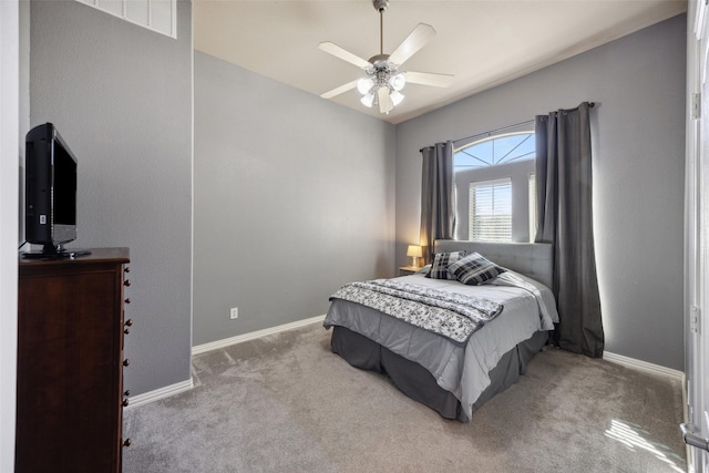 bedroom with ceiling fan and light carpet